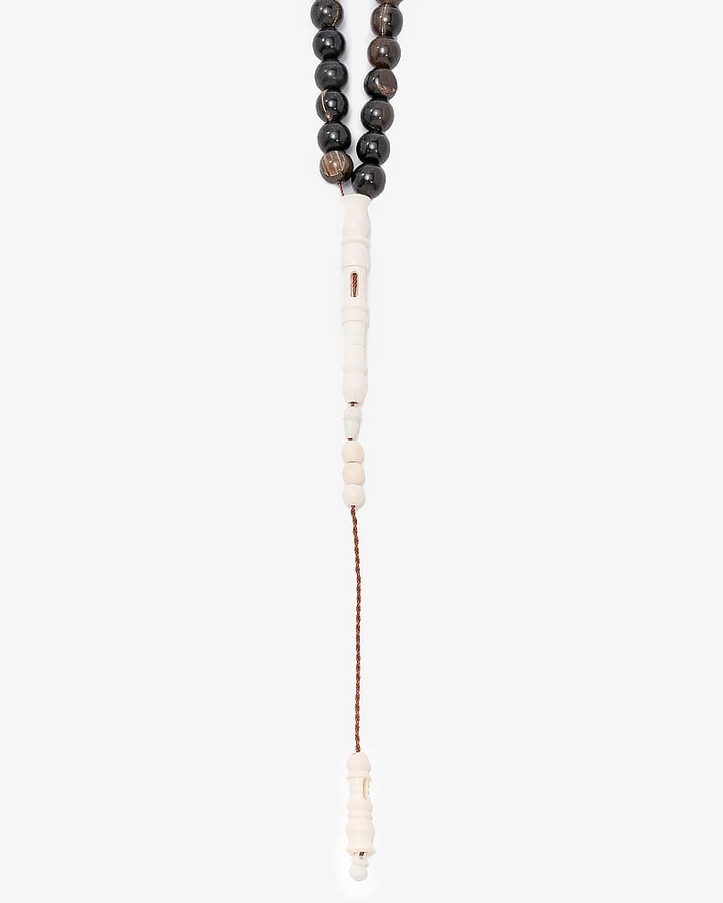 Buffalo horn rosary engraved with camel bone